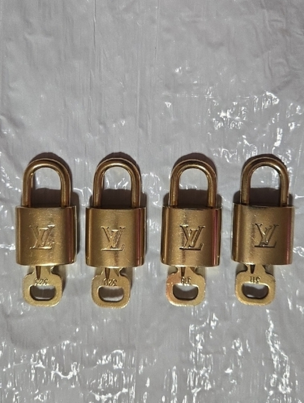 Louis Vuitton Gold Padlock Set of Four with LV Monogram - Picture 2 of 6